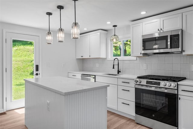 4736 Doyle Rd, Whitehall, PA 15227 - kitchen featuring stainless steel appliances, light wood-style flooring, backsplash, white cabinets, and recessed lighting
