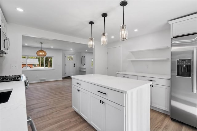 4736 Doyle Rd, Whitehall, PA 15227 - kitchen with appliances with stainless steel finishes, light wood-style floors, light countertops, white cabinets, and recessed lighting