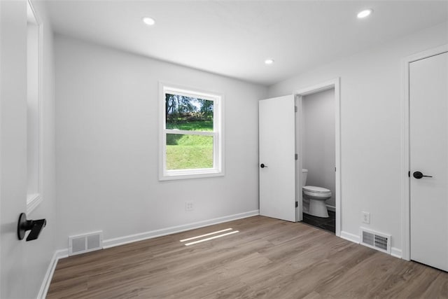 4736 Doyle Rd, Whitehall, PA 15227 - unfurnished bedroom featuring wood finished floors, recessed lighting, and ensuite bath
