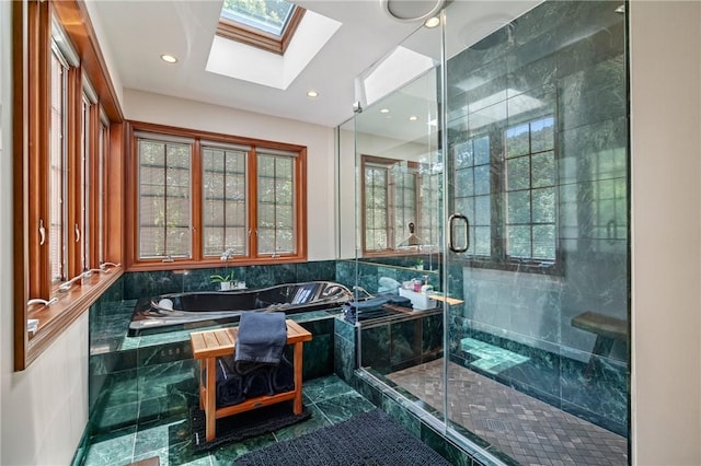 337 Fox Chapel Rd, Fox Chapel, PA 15238 - bathroom with a garden tub, a skylight, a stall shower, and recessed lighting