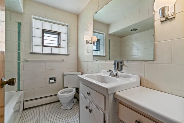 1518 Carlisle St, Natrona Hts/Harrison Twp, PA 15065 - full bathroom with baseboard heating, tile walls, vanity, and tile patterned flooring