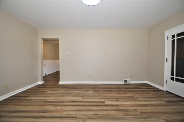312 Delmont Ave, Coolbaugh Twp, PA 15012 - spare room featuring wood finished floors and baseboards
