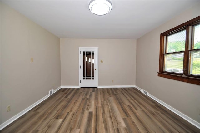 312 Delmont Ave, Coolbaugh Twp, PA 15012 - empty room with wood finished floors and baseboards