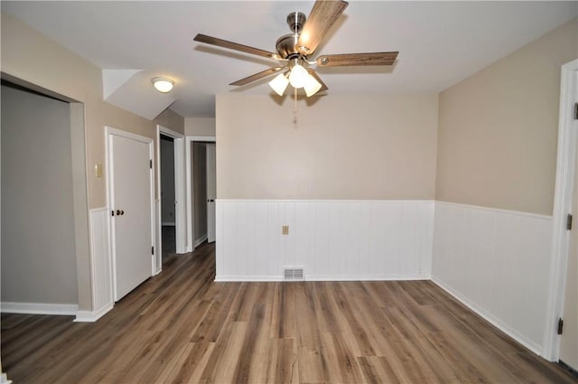 312 Delmont Ave, Coolbaugh Twp, PA 15012 - empty room with a wainscoted wall, wood finished floors, and ceiling fan