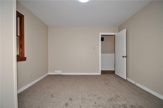 312 Delmont Ave, Coolbaugh Twp, PA 15012 - carpeted empty room featuring baseboards