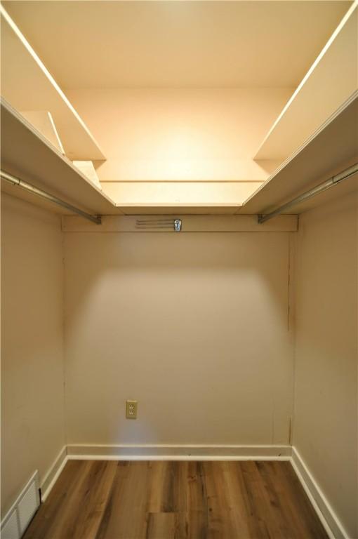 312 Delmont Ave, Coolbaugh Twp, PA 15012 - walk in closet featuring dark wood finished floors