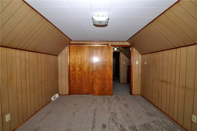 312 Delmont Ave, Coolbaugh Twp, PA 15012 - bonus room featuring carpet floors, wood walls, and vaulted ceiling