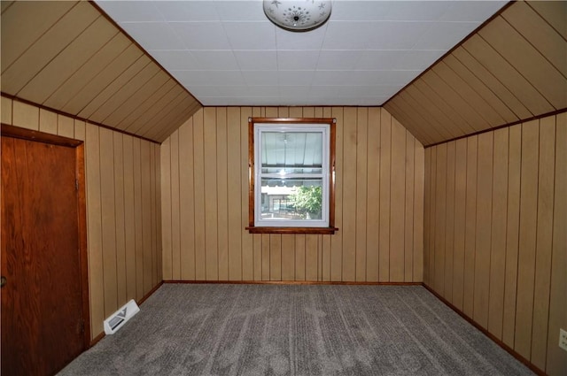312 Delmont Ave, Coolbaugh Twp, PA 15012 - additional living space with carpet floors, wood walls, and vaulted ceiling