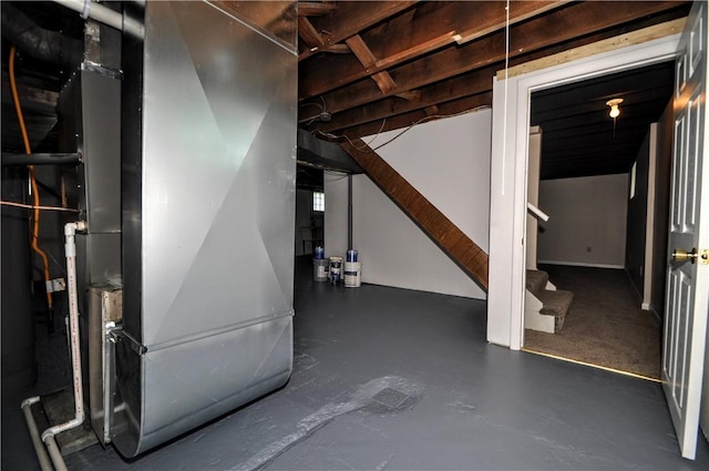 312 Delmont Ave, Coolbaugh Twp, PA 15012 - unfinished basement with heating unit and stairs