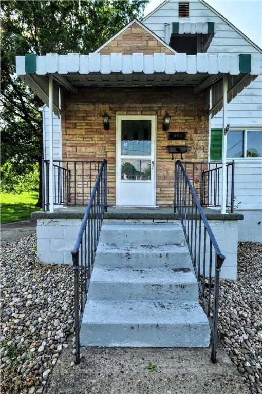 312 Delmont Ave, Coolbaugh Twp, PA 15012 - view of exterior entry with covered porch