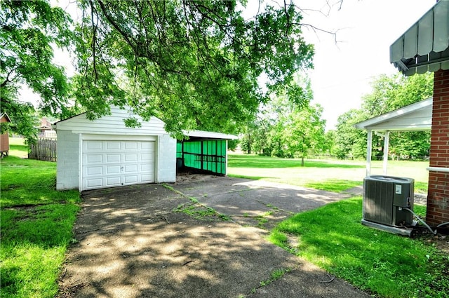 312 Delmont Ave, Coolbaugh Twp, PA 15012 - garage featuring a garage and driveway