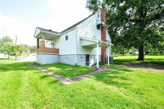 312 Delmont Ave, Coolbaugh Twp, PA 15012 - view of side of property with a chimney and a yard