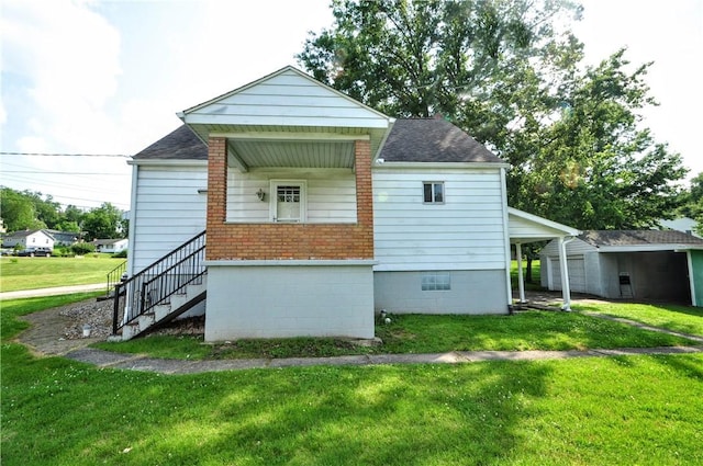 312 Delmont Ave, Coolbaugh Twp, PA 15012 - rear view of property with a yard, roof with shingles, and stairs