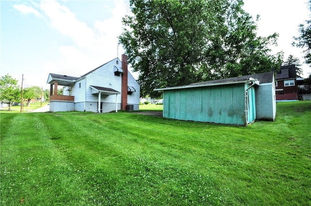312 Delmont Ave, Coolbaugh Twp, PA 15012 - view of green lawn featuring an outbuilding