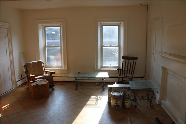 117 S Mckean St, City Of But Ne, PA 16001 - sitting room featuring healthy amount of natural light, tile patterned floors, and baseboard heating