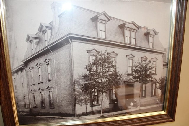 117 S Mckean St, City Of But Ne, PA 16001 - view of side of home featuring brick siding and mansard roof