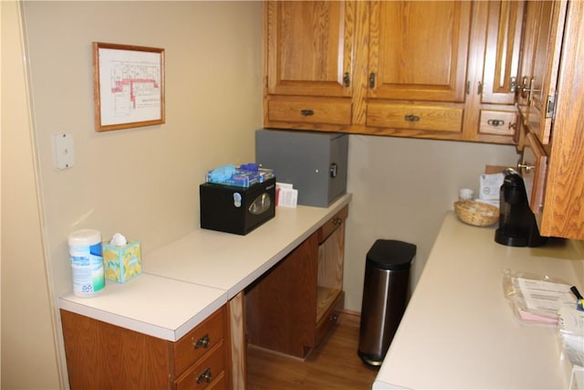 117 S Mckean St, City Of But Ne, PA 16001 - kitchen featuring light countertops, brown cabinetry, and wood finished floors