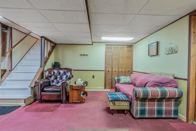 2509 Ridge Rd, Jefferson Hills, PA 15332 - carpeted living area with stairs, wood walls, a drop ceiling, and wainscoting