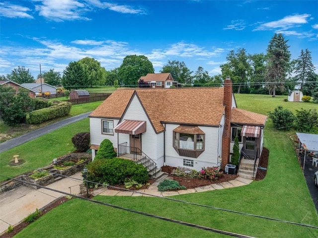 2509 Ridge Rd, Jefferson Hills, PA 15332 - bungalow-style house featuring a chimney, a front lawn, and driveway
