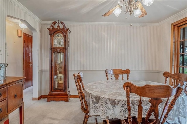 2509 Ridge Rd, Jefferson Hills, PA 15332 - dining area featuring a ceiling fan, light colored carpet, arched walkways, and ornamental molding