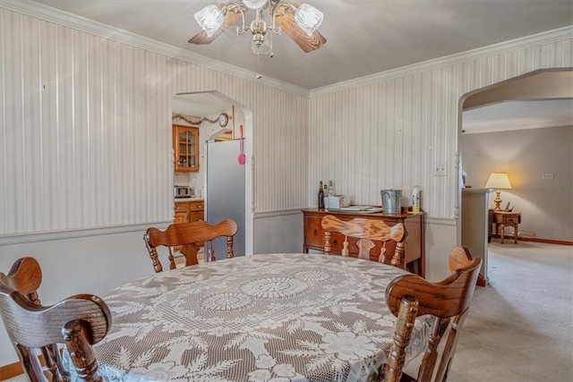 2509 Ridge Rd, Jefferson Hills, PA 15332 - dining space with arched walkways, ceiling fan, crown molding, and carpet floors