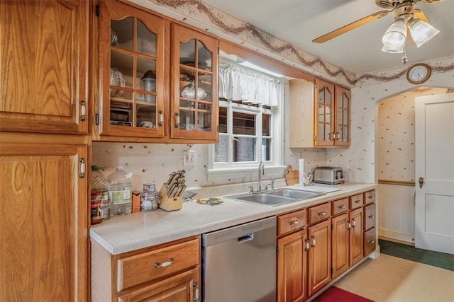 2509 Ridge Rd, Jefferson Hills, PA 15332 - kitchen with stainless steel dishwasher, light countertops, a ceiling fan, glass insert cabinets, and wallpapered walls