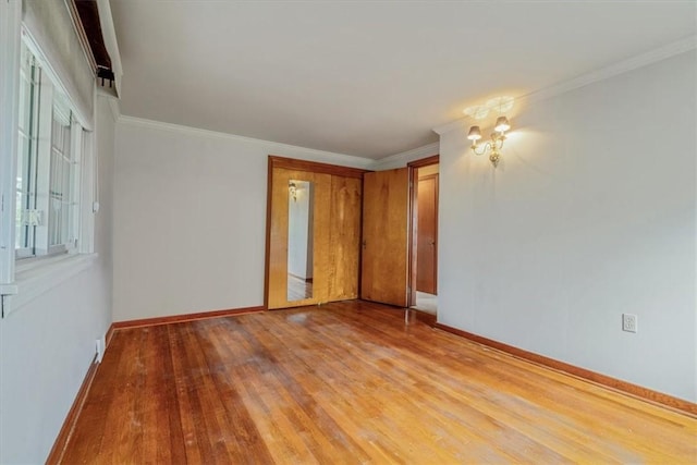 2509 Ridge Rd, Jefferson Hills, PA 15332 - unfurnished room featuring light wood-type flooring, a chandelier, and ornamental molding