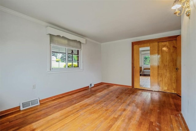 2509 Ridge Rd, Jefferson Hills, PA 15332 - unfurnished room featuring healthy amount of natural light, wood finished floors, crown molding, and a chandelier