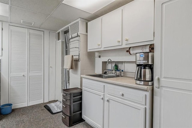 2509 Ridge Rd, Jefferson Hills, PA 15332 - kitchen with white cabinets, light countertops, carpet, and a paneled ceiling