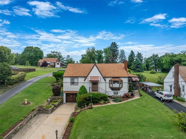 2509 Ridge Rd, Jefferson Hills, PA 15332 - view of front of property with concrete driveway, an attached garage, a front yard, and a chimney