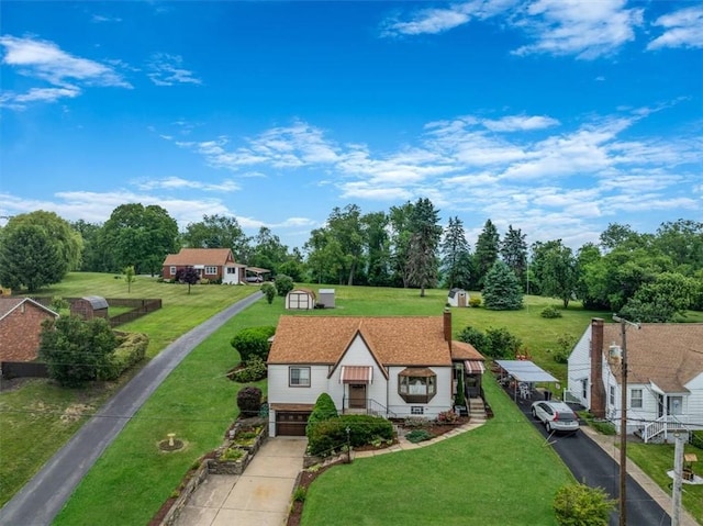 2509 Ridge Rd, Jefferson Hills, PA 15332 - tudor-style house with driveway, a front lawn, a garage, and view of scattered trees