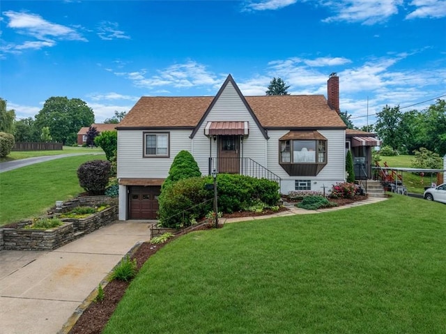 2509 Ridge Rd, Jefferson Hills, PA 15332 - view of front of home with a chimney, driveway, a shingled roof, a front lawn, and a garage