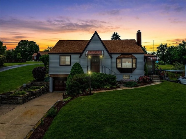 2509 Ridge Rd, Jefferson Hills, PA 15332 - view of front facade featuring a front lawn, a chimney, concrete driveway, an attached garage, and roof with shingles