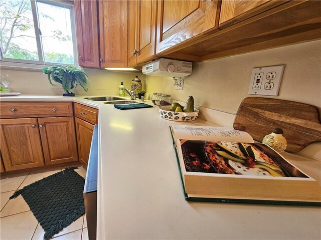 468 Lois Dr, Baldwin Boro, PA 15236 - kitchen with light tile patterned floors, light countertops, and brown cabinetry