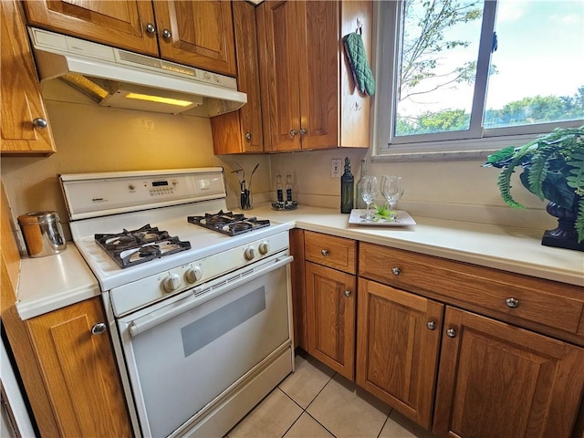 468 Lois Dr, Baldwin Boro, PA 15236 - kitchen with white gas range, under cabinet range hood, and brown cabinets