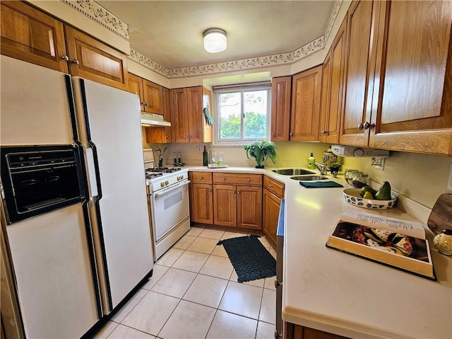 468 Lois Dr, Baldwin Boro, PA 15236 - kitchen with white appliances, under cabinet range hood, brown cabinets, light countertops, and light tile patterned floors
