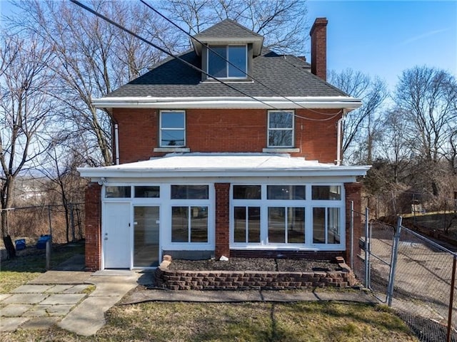 10207 Frankstown Rd, Penn Hills, PA 15235 - rear view of house featuring a chimney, brick siding, and a shingled roof