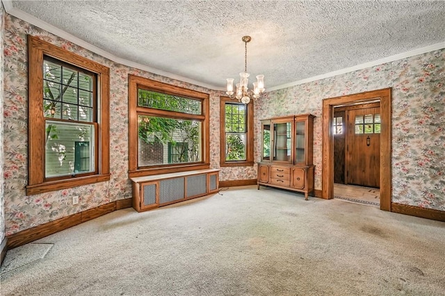 946 Alcoma St, Sharon, PA 16146 - spare room featuring crown molding, wallpapered walls, plenty of natural light, a textured ceiling, and a chandelier