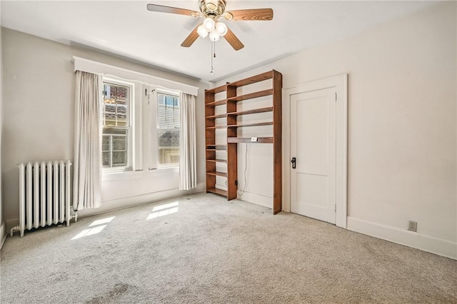 946 Alcoma St, Sharon, PA 16146 - unfurnished bedroom with radiator, carpet flooring, and a ceiling fan
