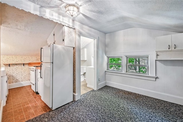 946 Alcoma St, Sharon, PA 16146 - kitchen with white appliances, a textured ceiling, white cabinetry, lofted ceiling, and wallpapered walls