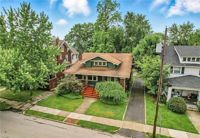 946 Alcoma St, Sharon, PA 16146 - view of front of property with a porch, a front lawn, and a chimney