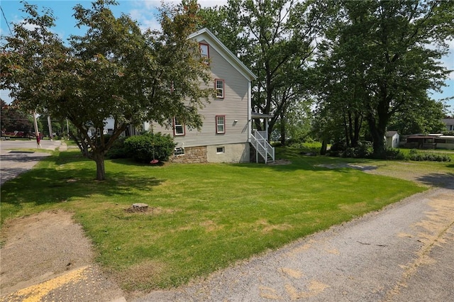 126 N Otter St, Mercer Boro, PA 16137 - view of side of property featuring stairway and a yard