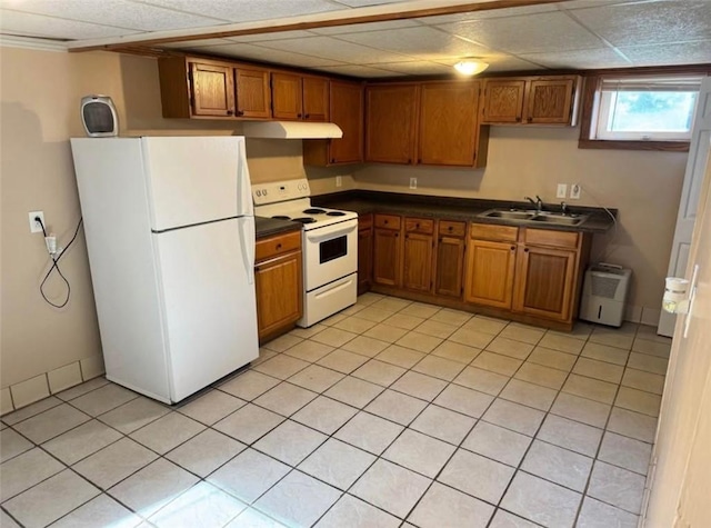 126 N Otter St, Mercer Boro, PA 16137 - kitchen with white appliances, under cabinet range hood, brown cabinetry, and dark countertops