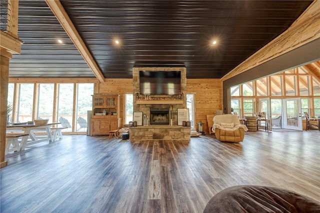 1060 Wattersonville Rd, Coolbaugh Twp, PA 16218 - living room with a fireplace, wood finished floors, wood walls, and high vaulted ceiling