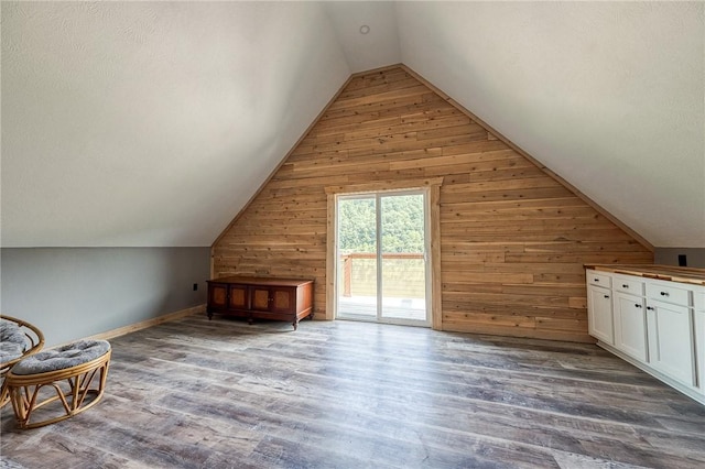 1060 Wattersonville Rd, Coolbaugh Twp, PA 16218 - bonus room with wood walls, vaulted ceiling, and wood finished floors
