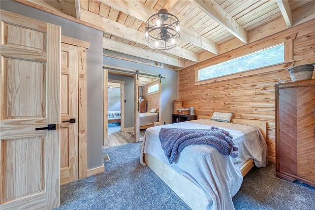 1060 Wattersonville Rd, Coolbaugh Twp, PA 16218 - bedroom with a wood ceiling with exposed beams, wooden walls, carpet floors, and a barn door