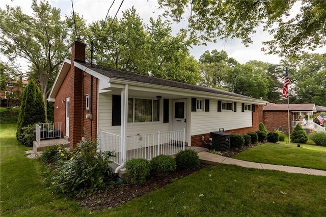 433 Wyndhurst Dr, Moon/Crescent Twp, PA 15108 - ranch-style home with a chimney, a front lawn, and brick siding