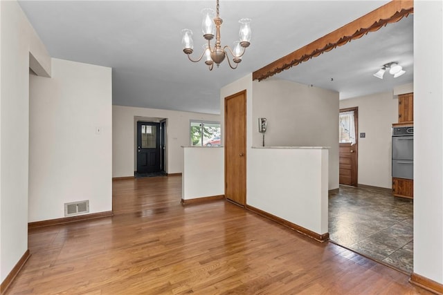 433 Wyndhurst Dr, Moon/Crescent Twp, PA 15108 - spare room featuring a chandelier and light wood-type flooring