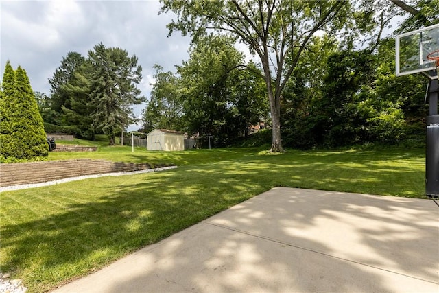 433 Wyndhurst Dr, Moon/Crescent Twp, PA 15108 - view of green lawn with a storage unit and a patio