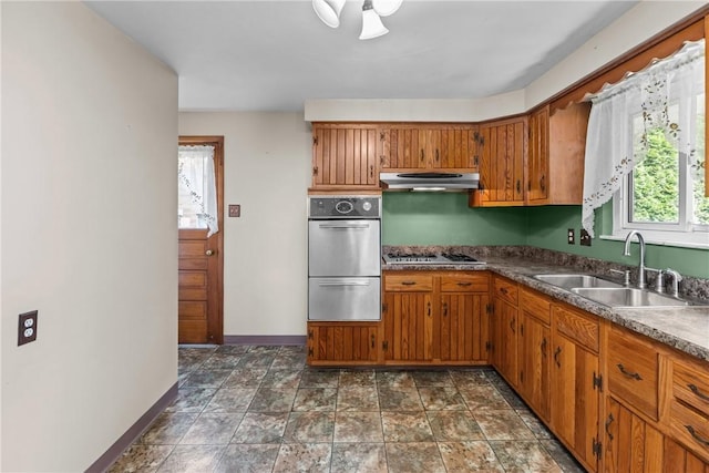 433 Wyndhurst Dr, Moon/Crescent Twp, PA 15108 - kitchen featuring stainless steel appliances, brown cabinetry, a warming drawer, and under cabinet range hood
